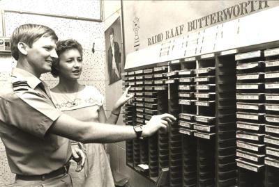 1984: Radio RAAF Butterworth station production manager Flight Lieutenant Peter Howman with announcer Bronwyn Tuohy going through the recorded tape tracks.