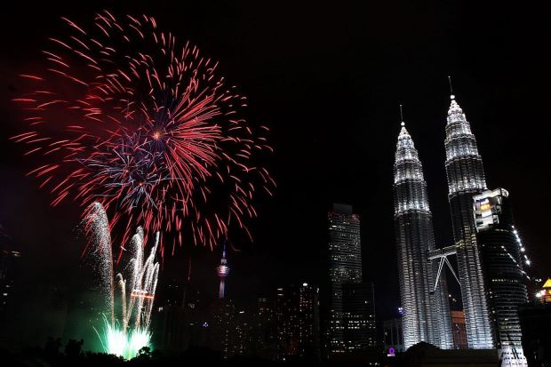 Fireworks light up the sky over KLCC during New Year celebrations in Kuala Lumpur on January 1st 2016.
