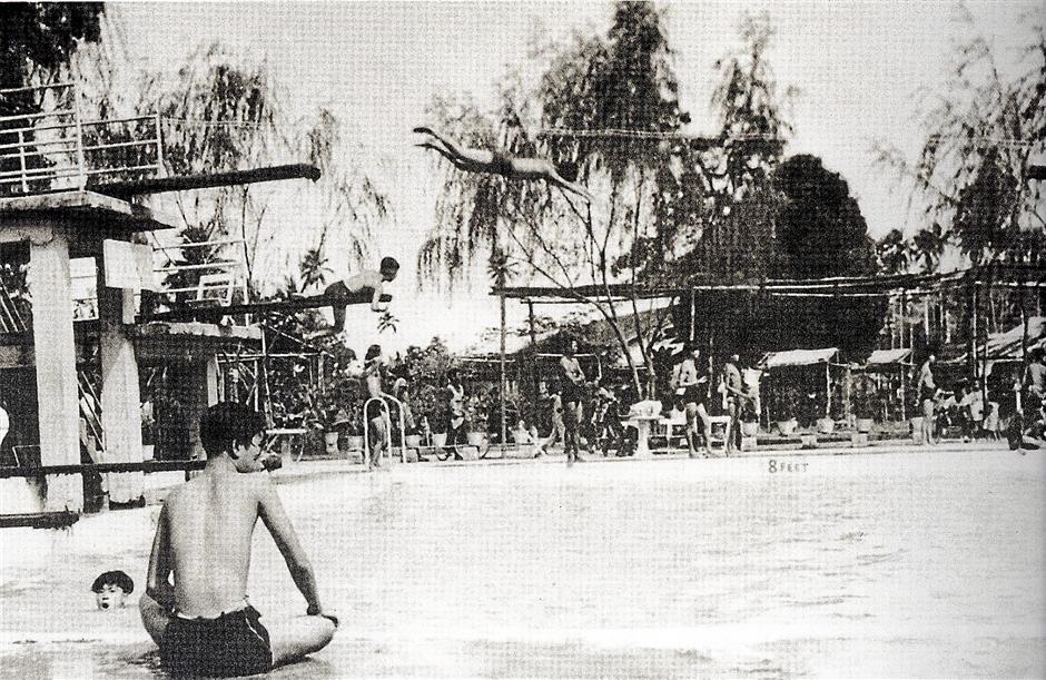 Youth enjoying the swimming pool at the Eastern Garden Amusement Park in Ayer Itam in 1950. After several drownings. the popular park lost its lustre. - Recopy pix of Ayer Itam
