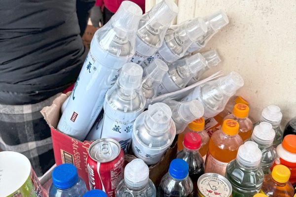 Drinking water and oxygen canisters on sale side by side.